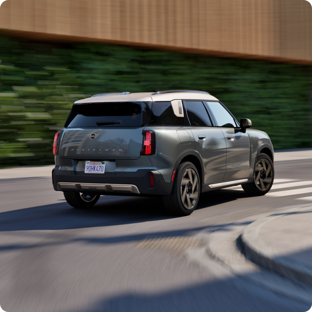 The MINI Countryman S ALL4 cruises down a street.