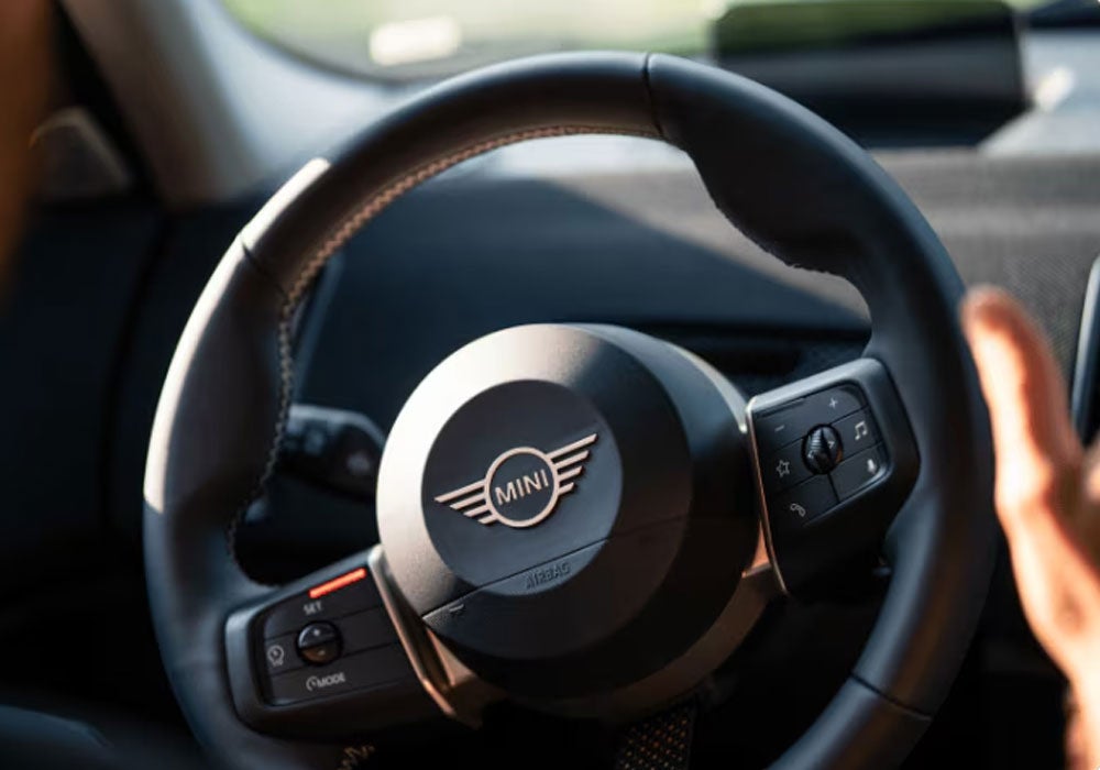 Close up of MINI vehicle steering wheel.